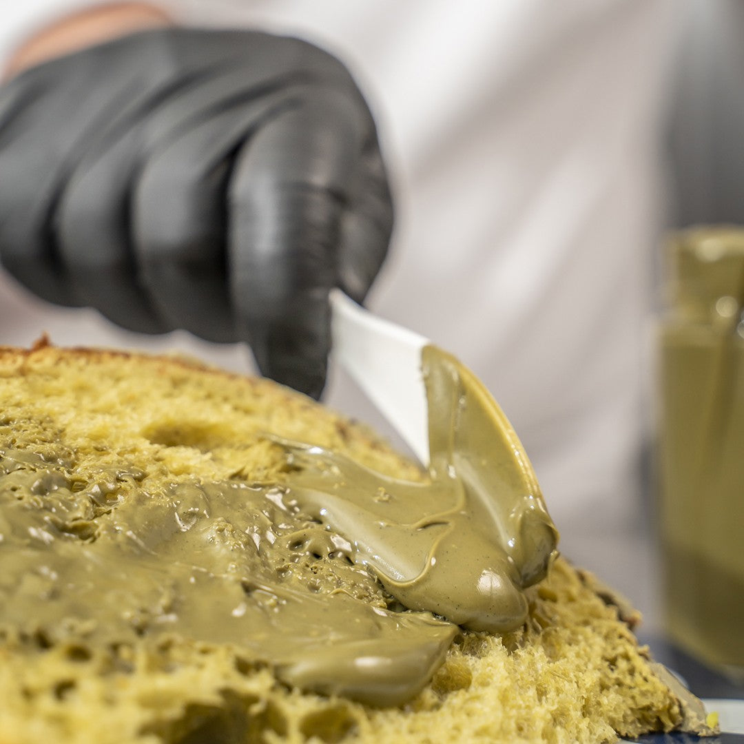 Artisanal Pistachio Colomba, with a jar of artisanal pistachio spread